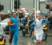 jonathan edwards and the olympic torch in wandsworth 26 june 2004