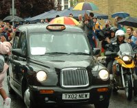 the olympic torch left wandsworth in a black cab